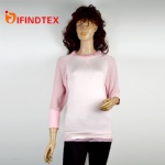 Ladies knitted top, 95%viscose 5%elastane in front, 100%polyester in the back.